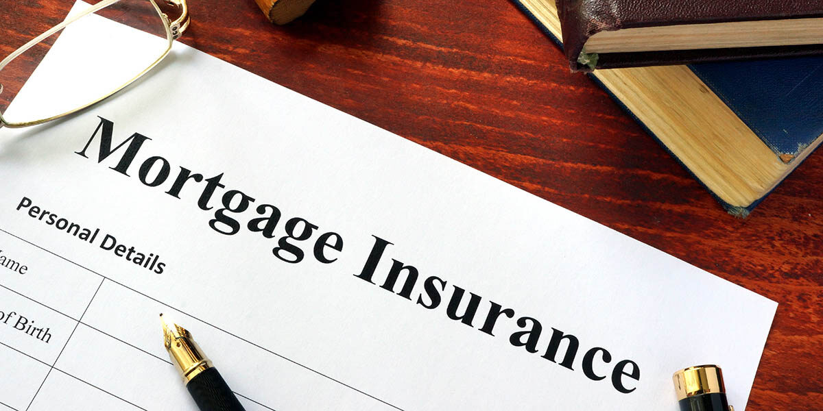 Mortgage Insurance form on desk with pens. Bakersfield, CA.